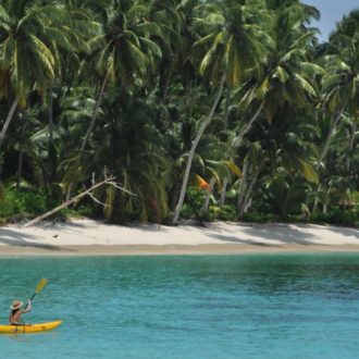 Kayaking coral reefs in Mentawai.